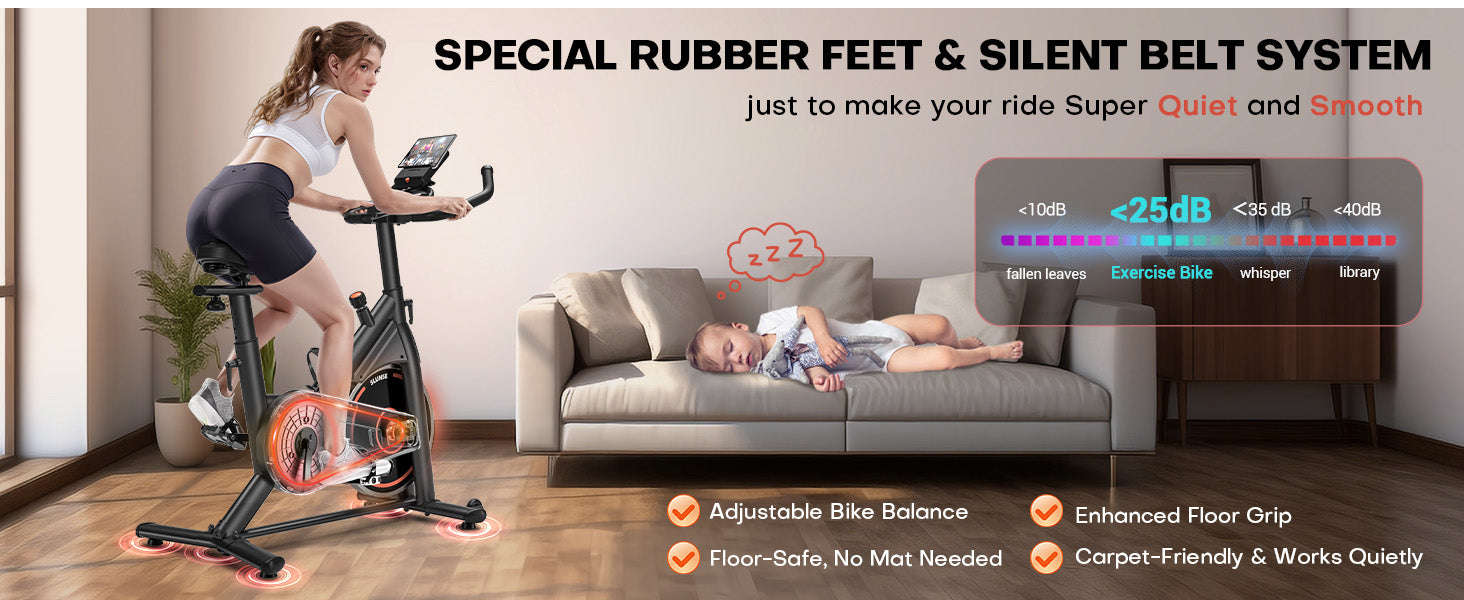 Mujer haciendo ejercicio en una bicicleta estática con un bebé durmiendo en un sofá, enfatizando la tranquilidad y la comodidad.